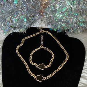 Elegant Gold Bracelet and Necklace Set with Black Flower Charm